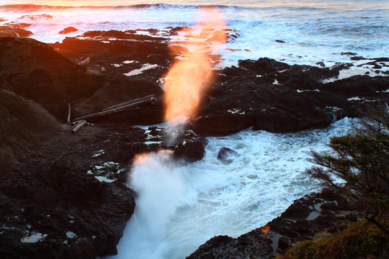 Cook's Chasm spouting horn lit up by  sunlight