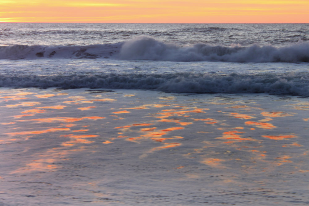 Shimmering sunset waves at Gleneden Beach