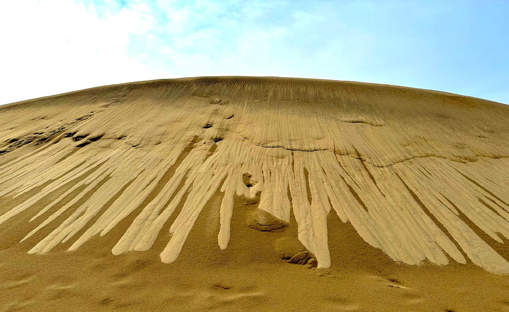 One Week Later, Rare Sand Shapes Atop Oregon Coast Cape Are Fading But Evident