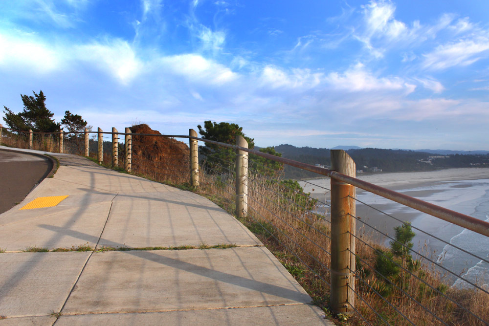 Newport's Yaquina Head Outstanding Natural Area: road going up the hill and Agate Beach below