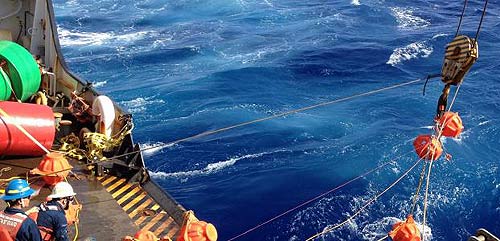 Photo: researchers deploy the hydrophone into the trench