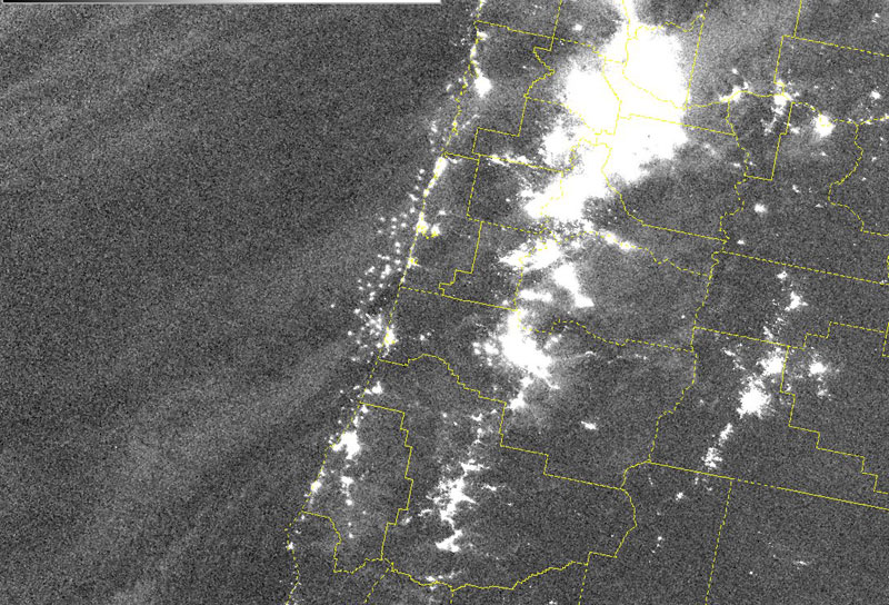 Spacecraft Captures Images of Oregon Coast Crabbers Aglow 